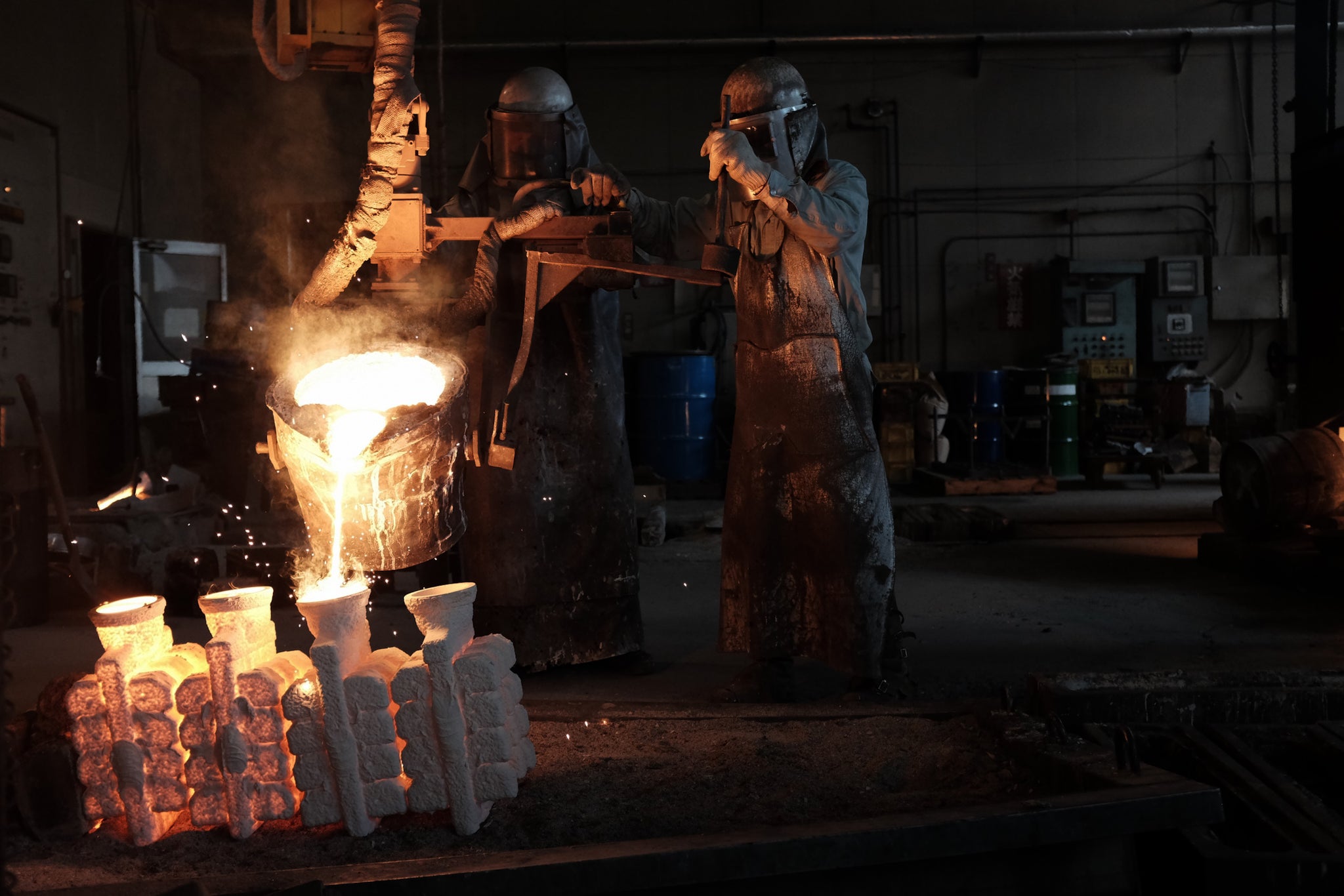 japanese lost wax casting process pouring molten metal into molds creating intricate shapes